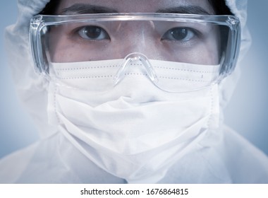 A doctor wearing personal protective equipment or ppe including mask, goggle, and suit to protect COVID-19 infection. coronavirus, medical, healthcare, quarantine concept - Shutterstock ID 1676864815