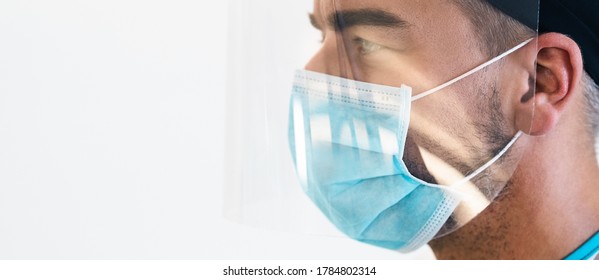 Doctor wearing ppe face surgical mask and visor fighting against corona virus outbreak - Health care and medical workers concept - Shutterstock ID 1784802314
