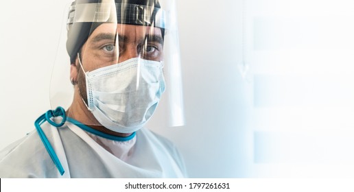 Doctor Wearing Ppe Face Surgical Mask And Visor Fighting Against Corona Virus Outbreak - Health Care And Medical Workers Concept 