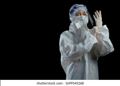 Doctor Wearing Ppe Suit, Face Mask, Surgical Glove And Face Shield , Corona Virus, Covid-19 Virus Outbreak Concept Black Background