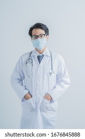 Doctor Wearing Protection Face Mask Against Coronavirus.Asian People