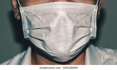 Doctor wearing protection mask against coronavirus, which are medical protective equipment, text space. - Shutterstock ID 1693183459