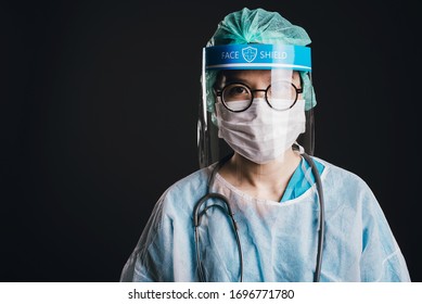 Doctor wearing Protection suit with stethoscope against covid-19 (Coronavirus) on black background, Concept of Covid-19 quarantine. - Powered by Shutterstock