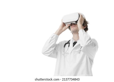 A Doctor Wearing VR Headset Which Is Looking Up Over Isolated White Background. Concept Virtual Reality Medical Healthcare Service Technology. Virtual Medical Education Learning By AR Study. Metaverse