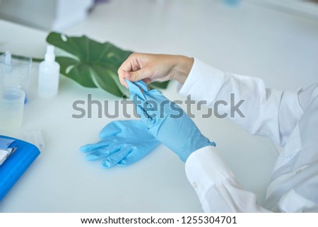 doctor wears gloves
