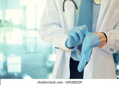 doctor wears medical gloves 