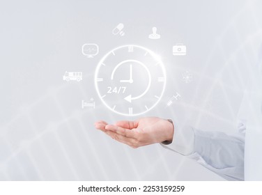 Doctor in a white coat uniform holding 24-7 service icon for assistance patient when accident or emergency, Medical call center service without interruption day and night. 
