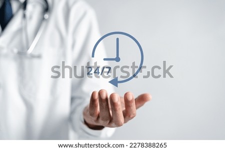 Doctor in a white coat uniform holding 247 service icon for assistance patient when accident or emergency, Medical call center service without interruption day and night.