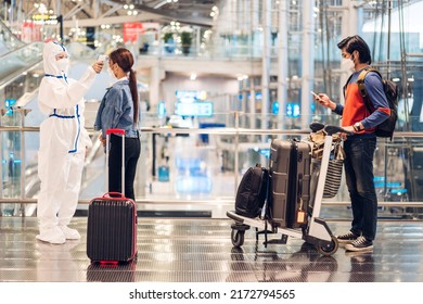 Doctor Woman Use Infrared Forehead Thermometer For Checking Body Temperature Scan Travel Passenger Fever In Quarantine For Coronavirus Wearing Safety Protective Mask At International Terminal Airport