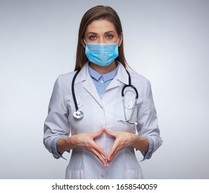 Doctor Woman Wearing Medical Mask And Uniform. Isolated Female Portrait.