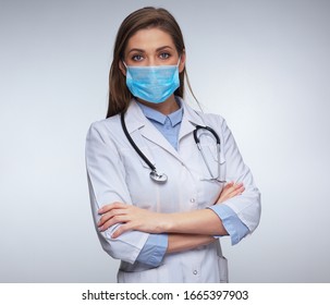 Doctor Woman Wearing Medical Mask And Uniform. Isolated Female Portrait.