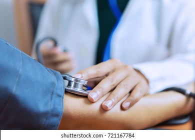 Doctor Women Is Checking Patient With Stethoscope And Measure Blood Pressure.