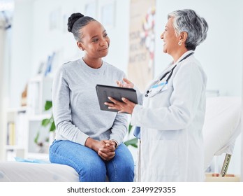 Doctor, women and tablet for happy healthcare, hospital news and support with test results or exam on bed. Senior nurse and patient with digital registration, clinic sign up and medical consultation - Powered by Shutterstock