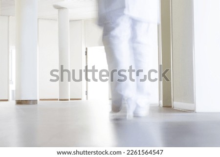 doctor at work in a clinic or hospital, bodypart legs in motion, concept healthcare and medicine