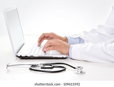 Doctor At Work, Close Up Of Male Doctor Typing On A Laptop