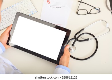 Doctor Working With A Blank Screen Tablet On His Desk. View From Above, Space For Text