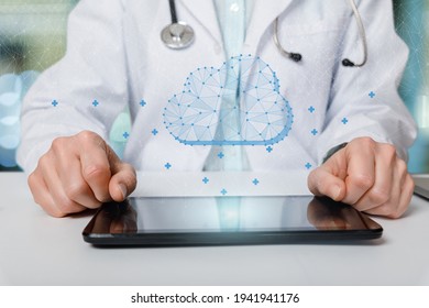 Doctor working with cloud on computing in tablet computer on blurred background.