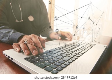 Doctor Working With Laptop Computer In Medical Workspace Office And Overcast Exposure Effect With Social Media Diagram