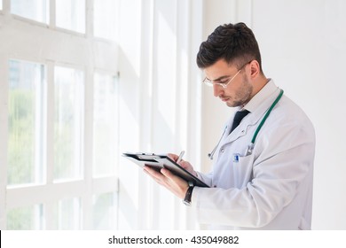 Doctor Working Near Window In A Hospital. 