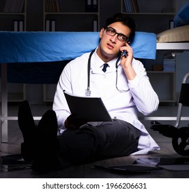 Doctor Working Night Shift In Hospital After Long Hours