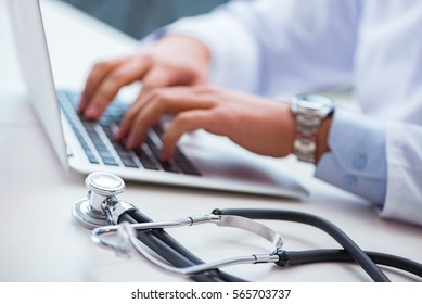 Doctor Working On The Computer