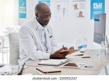 Doctor Working On Schedule, Planning Date Or Medical Note For Diagnosis Report In A Hospital Office. Healthcare Expert Doing Paper Work, Checking Records Or Writing Signature On Insurance Document