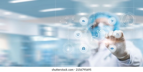 Doctor working on virtual computer screen with stomach diagnostics. - Shutterstock ID 2156795695