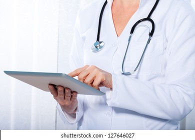 doctor working with  tablet, - Shutterstock ID 127646027