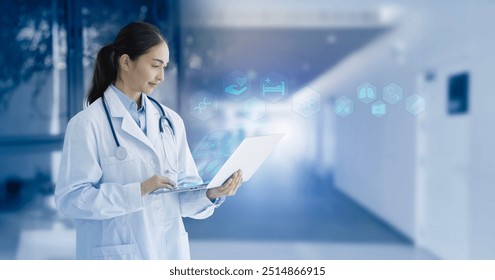 Doctor working using laptop with patient data entry in a hospital or clinic, medical technology, Healthcare, Medical and healthcare concept. - Powered by Shutterstock