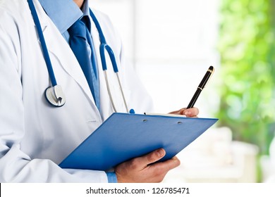 Doctor Writing A Medical Prescription