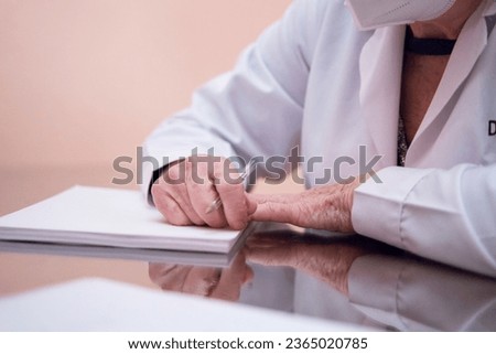 Similar – Female doctor filling out a questionnaire to senior patient