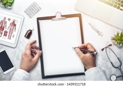 Doctor Writing On The Desk, Top View, Background