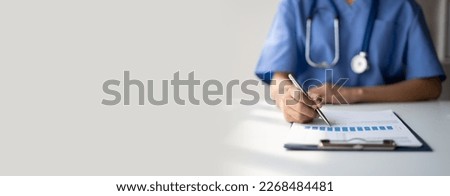 Doctor writing on a prescription note. copy space.