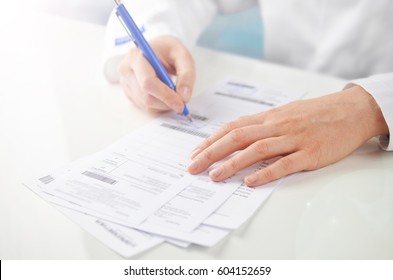 Doctor Writing A Prescription.