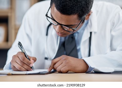 Doctor Writing A Prescription, Survey Or Medical Care Paperwork For A Patient At The Hospital. A Healthcare Professional Writing A Patient Information Chart. A GP Filing A Document In An Office