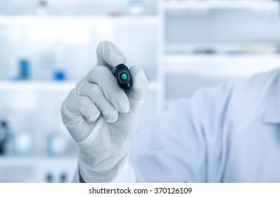 Doctor Writing Virtual Screen On The Air With Marker In Hospital Hallway.Toned Image.