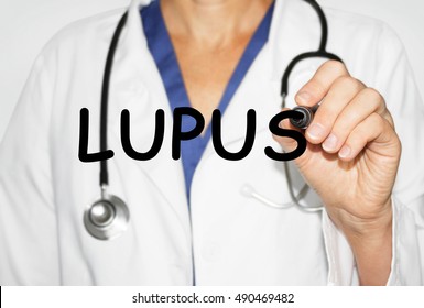 Doctor Writing Word Lupus, Medical Concept