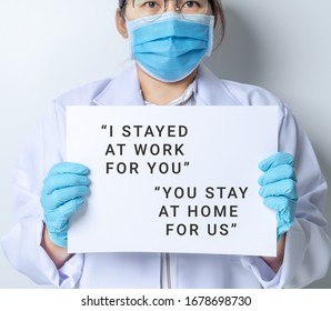 Doctor Written With I Stay At Work For You, You Stay At Home For Us. Worried About Covid-19 Coronavirus.