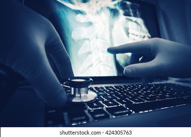 Doctor Xray Imagery Examination On The Laptop Computer.
