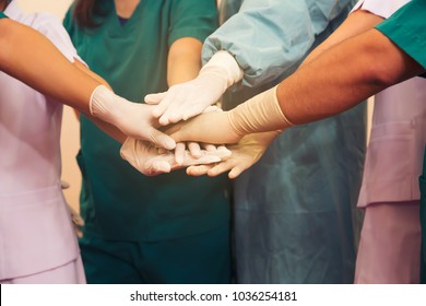 Doctor,nurse and staff's hand stack together. Team work to success in job,health patient.
