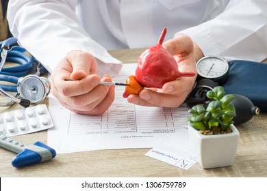 At Doctors Appointment Physician Shows To Patient Shape Of Prostate Gland With Focus On Hand With Organ. Scene Explaining Patient Causes And Localization Of Diseases Of Prostate, Problems And Signs