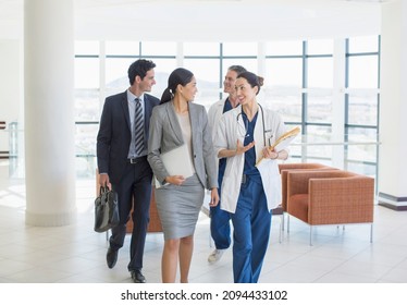 Doctors and business people talking - Shutterstock ID 2094433102