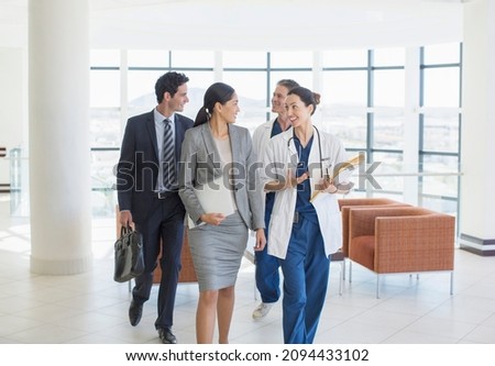 Doctors and business people talking