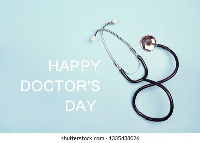 Doctor's Day Greeting Card With Stethoscope On Blue Background.