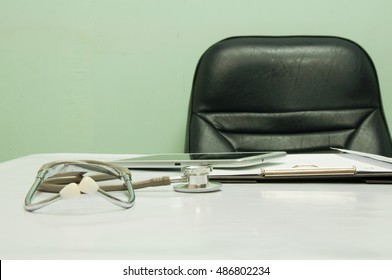 Doctor's desk with medical accessories - Powered by Shutterstock