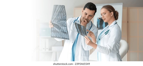 Doctors discussing MRI images in clinic. Banner for design - Shutterstock ID 2395465549