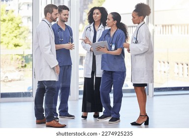 Doctors, diversity team and discussion in clinic for surgery planning, agenda report and medical schedule. Healthcare group, hospital employees and paperwork for expert help, results or collaboration - Powered by Shutterstock