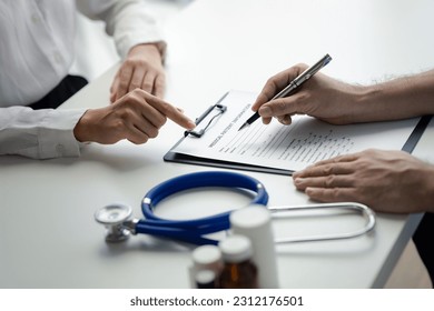 Doctors are giving advice on treatment to patients in hospital examination rooms, treating diseases from specialists and providing targeted treatment. Concepts of medical treatment and specialists. - Powered by Shutterstock