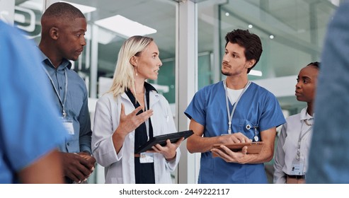 Doctors, group and meeting on tablet for medical planning, advice and support in teamwork or hospital solution. Healthcare staff, people and leader on digital technology and talking of clinic results - Powered by Shutterstock