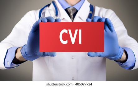 Doctor's Hands In Blue Gloves Shows The Word CVI (chronic Venous Insufficiency). Medical Concept.